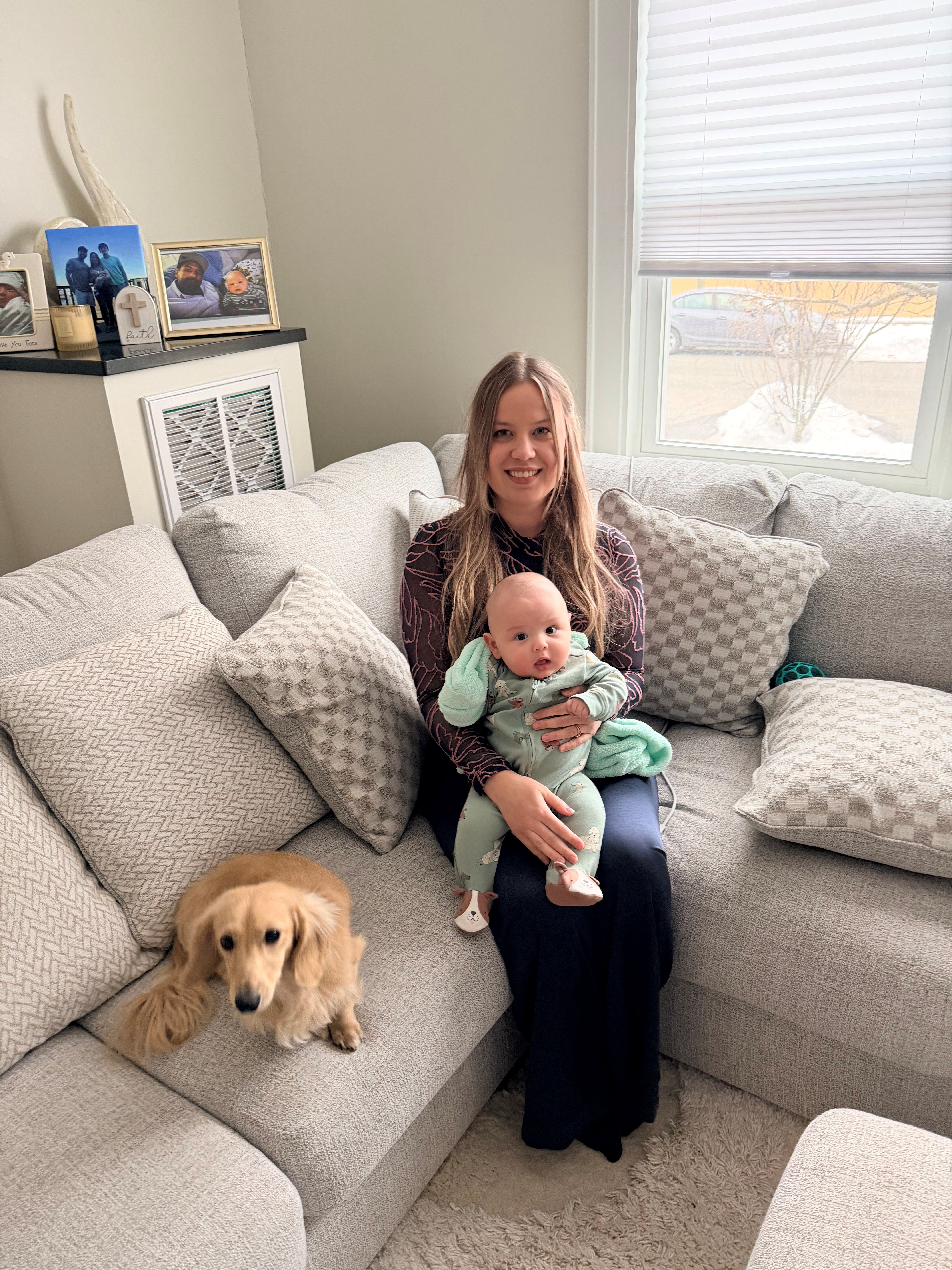 Laura with her baby and dachshund